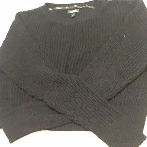 Woman’s black sweater